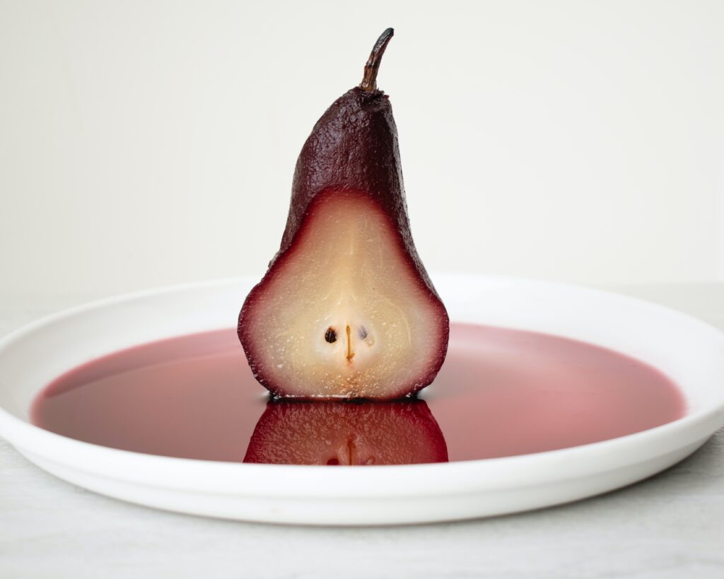 Poached pear over syrup