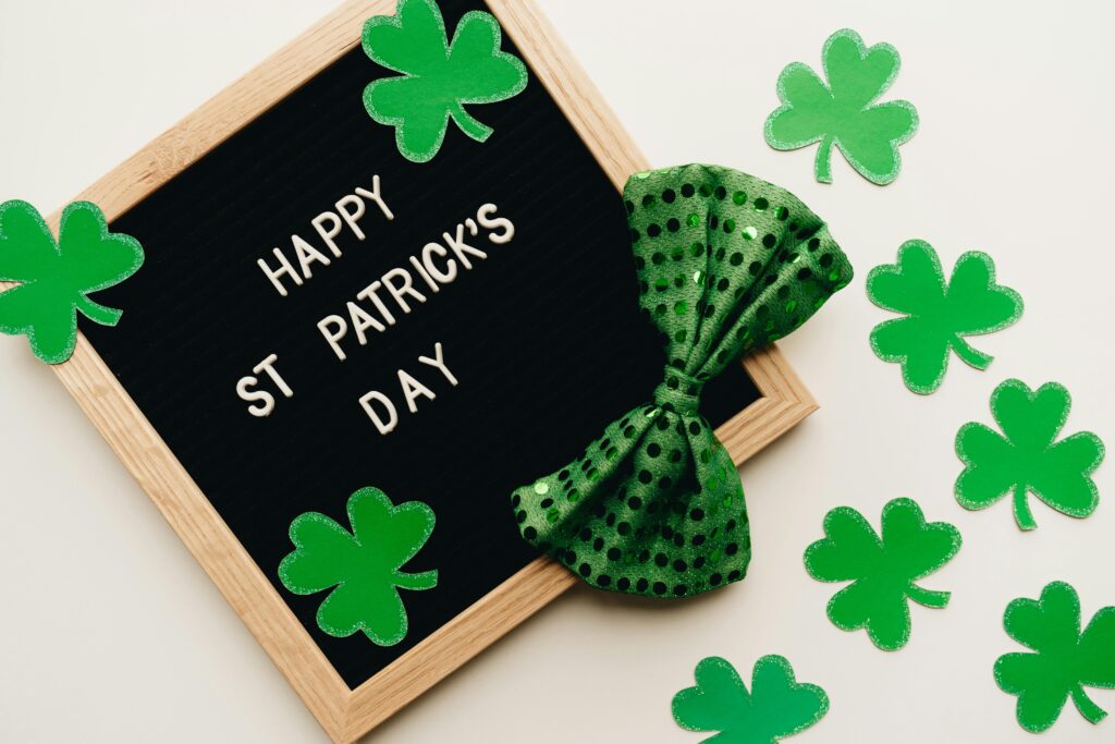 Happy St. Patrick’s Day tea party sign and decorations, shamrocks, and green bow tie