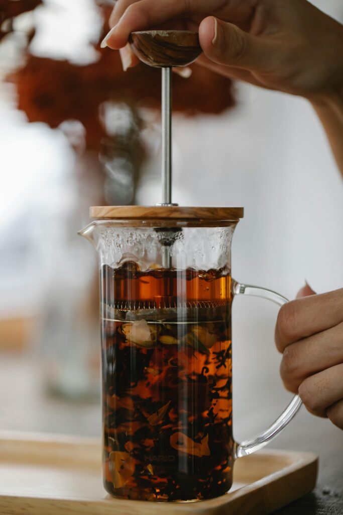 Teabloom borosilicate glass tea press steeping tea leaves