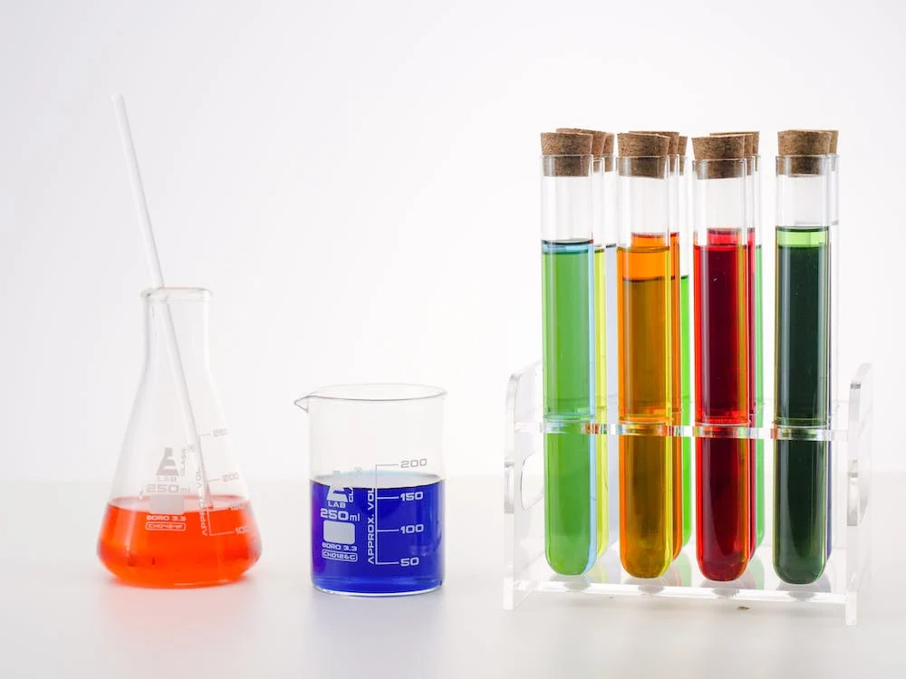 Laboratory lead-free borosilicate glass beakers and viles with colorful liquids