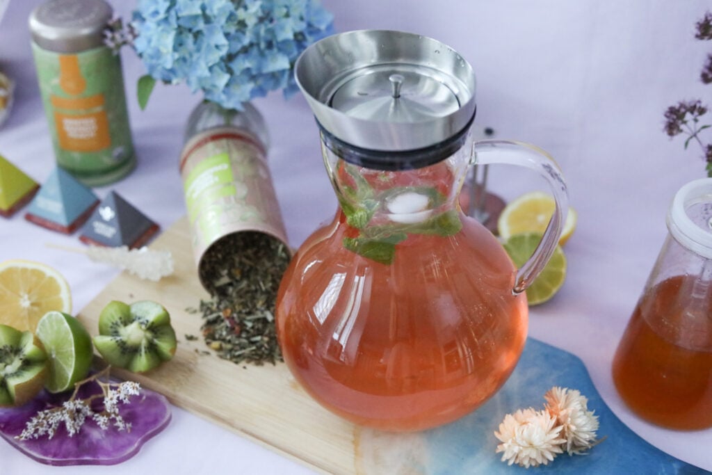 Teabloom iced tea pitcher with black tea and mint leaves