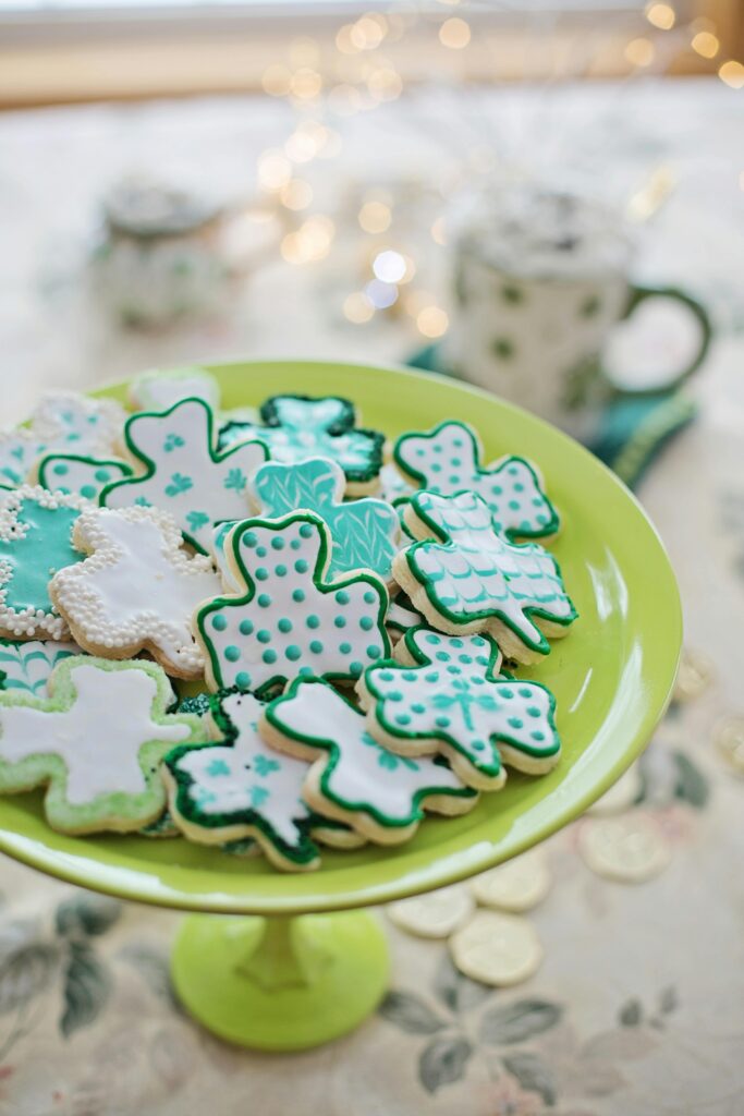 St. Patrick’s Day tea sugar cookies on green pedestal