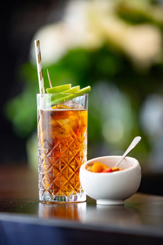 How to make herbal tea in tall iced glasses with fresh fruit and a straw