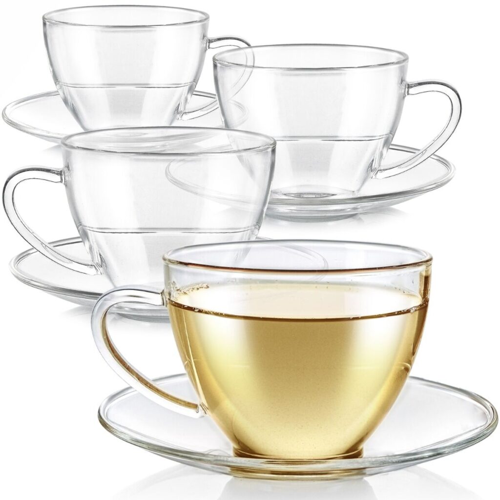 Four classic handled teacups and saucers made of borosilicate glass.