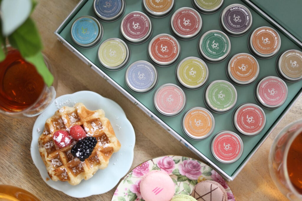 Sustainable teas in small colorful canisters