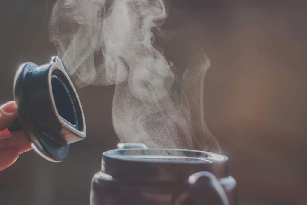 Steaming pot of tea as a detox facial and a way to use tea for skin health.