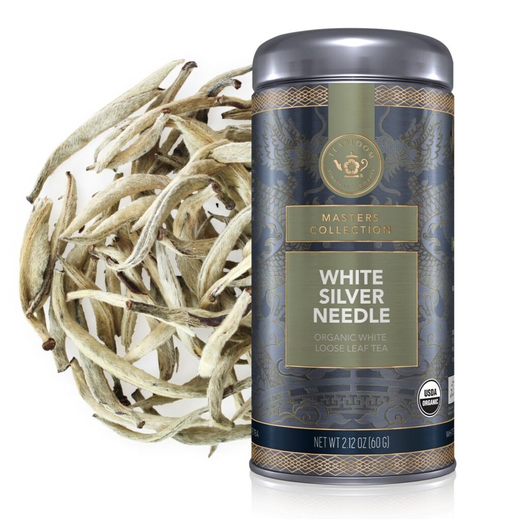 Teabloom’s White Silver Needle whole-leaf white tea canister and a closeup of tea.