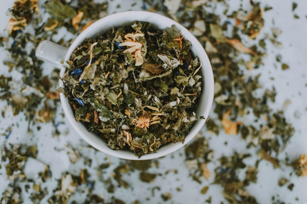 Wellness tea herbal blend in a white cup as an example of a functional tea trend.