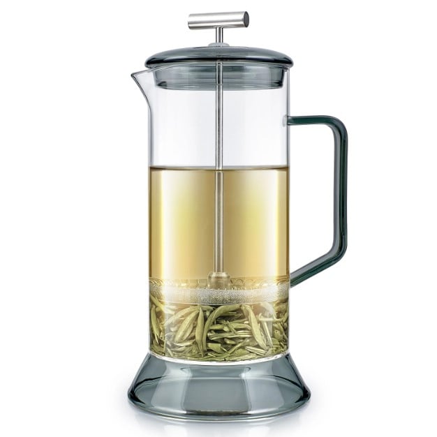 A plastic-free glass and stainless steel tea press and coffee press with grey accents.