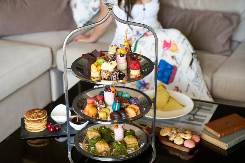 An afternoon tea three-tiered stand display filled with goodies and tea party menu ideas.